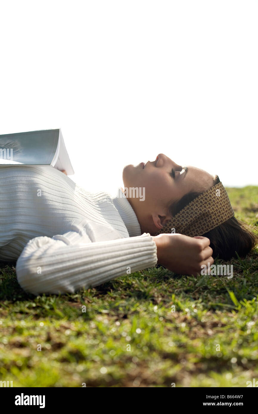 Young woman resting in the park Stock Photo - Alamy