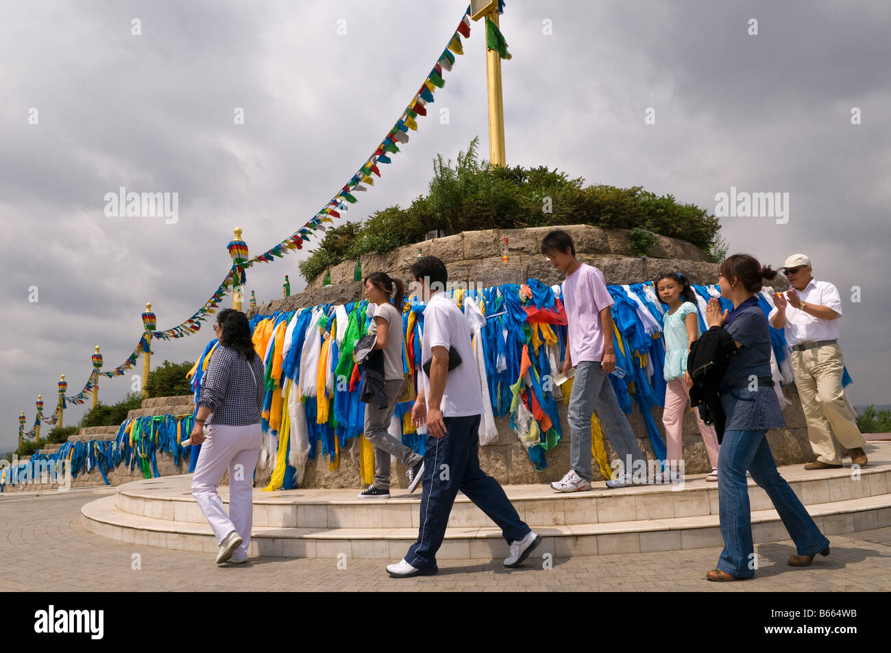 Prayer shawls adorn hill top shrine at Buddhist temple Xilinhot Inner