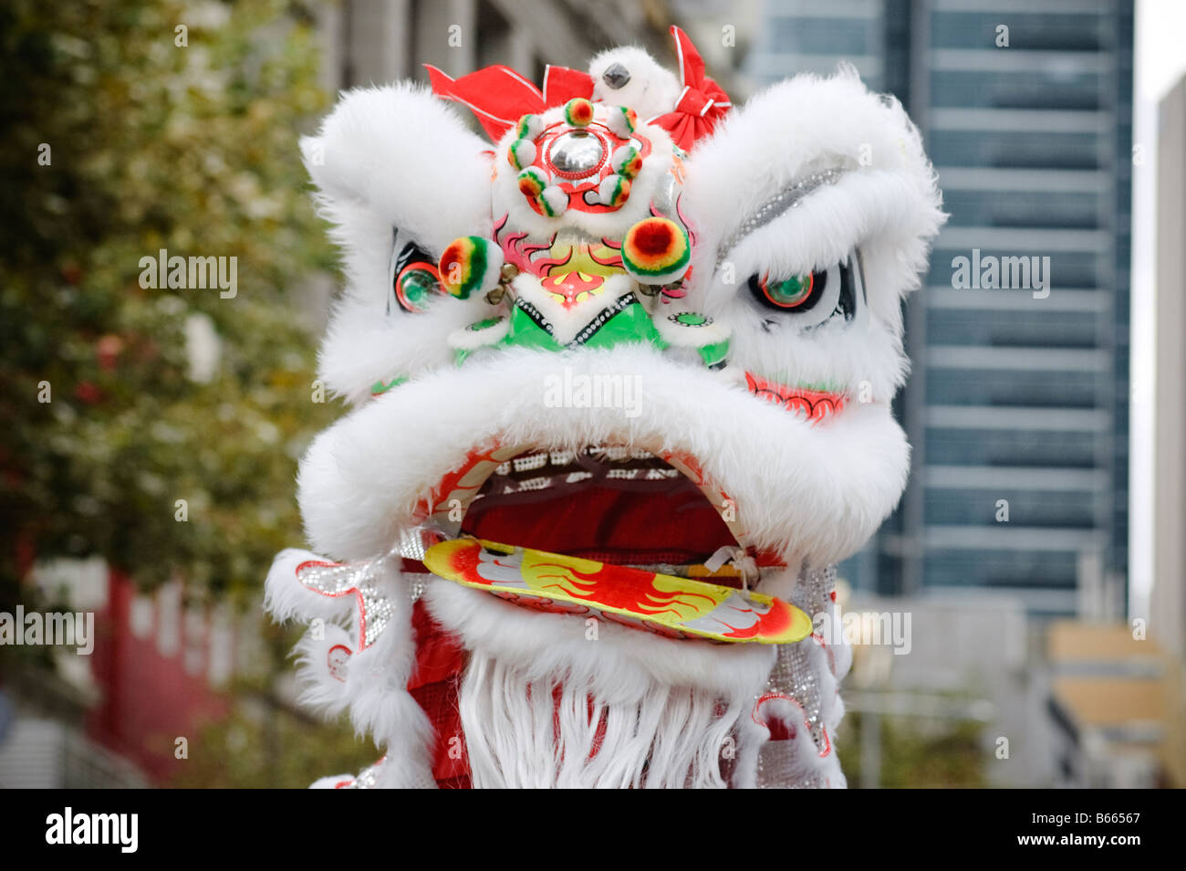 Dragon/lion head in Chinese New Year Parade. A Chinese dragon dance costume with mask. Dragon dancing in Chinese New Year celebrations, festivities. Stock Photo