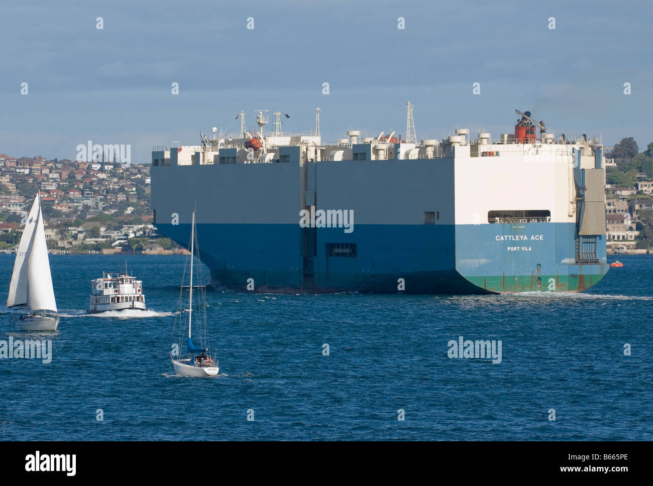 A large car-carrying ship leaves Sydney Harbour after depositing its cargo Stock Photo