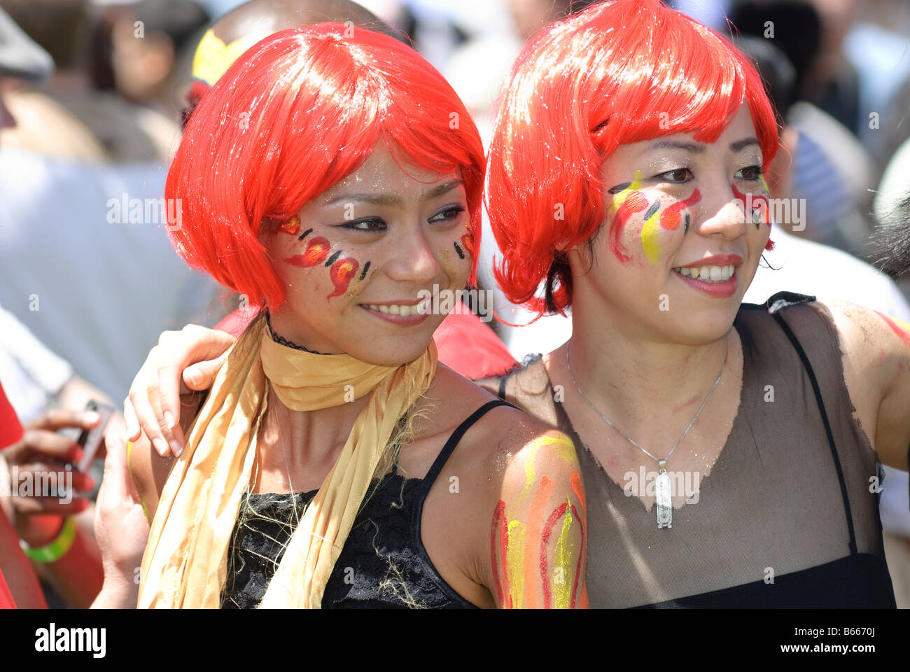 Young ladies in high spirits enjoying the Chinese New Year festivities. Stock Photo
