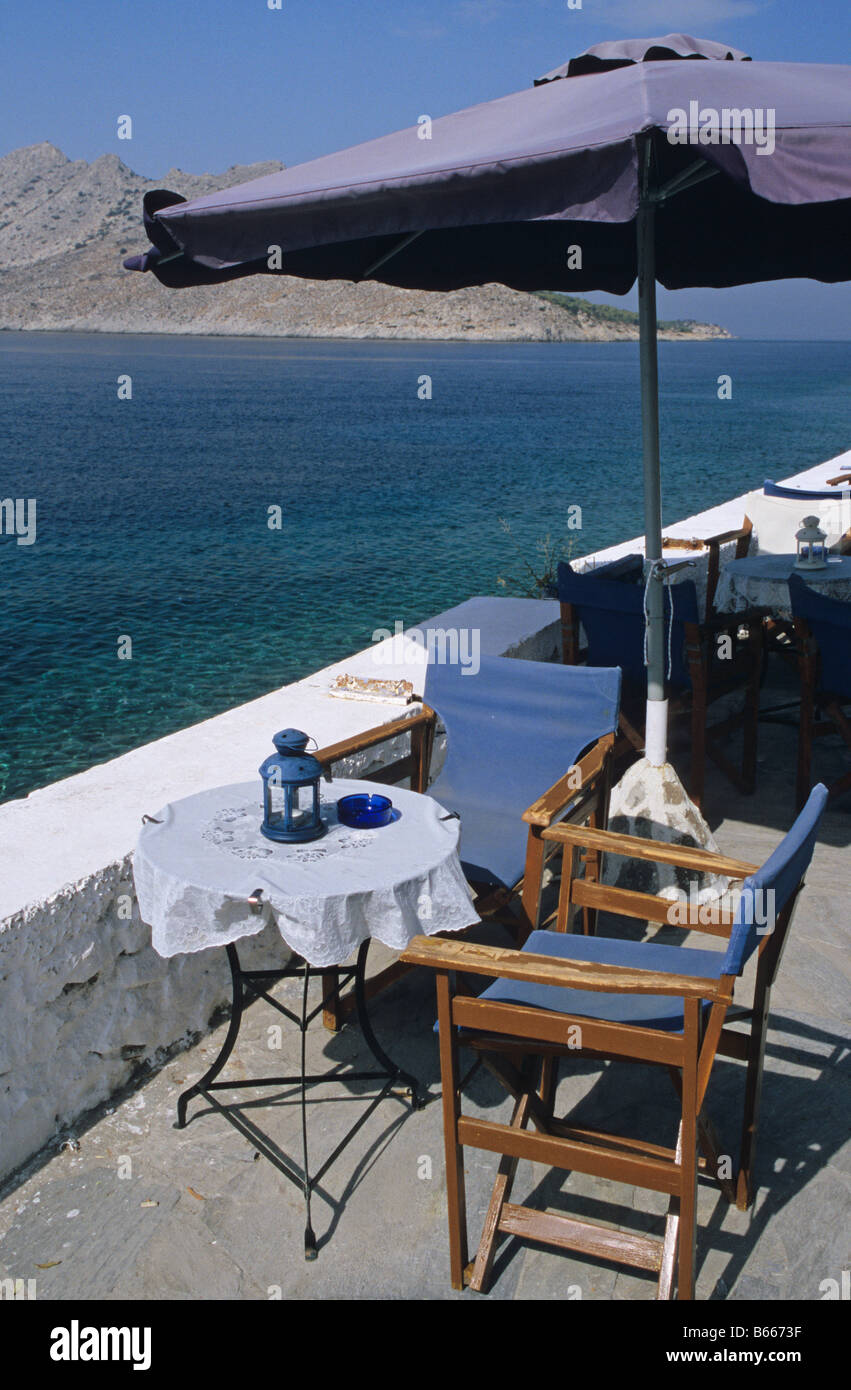 Cafe table by the sea, Aegina, Greece Stock Photo