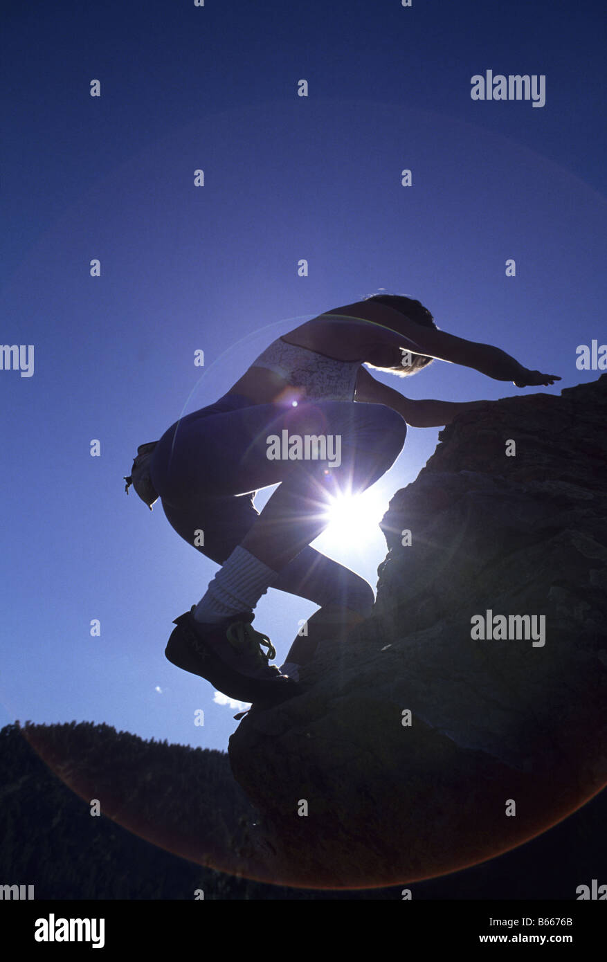 Woman rock climbing without equipment Stock Photo Alamy
