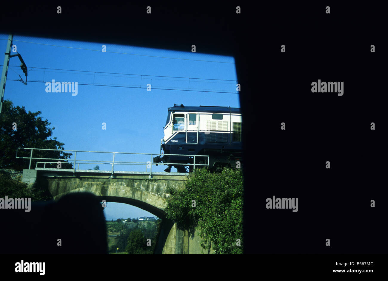 Crossing a bridge in Asturias TRANSCANTABRIAN TRAIN through the north of SPAIN Stock Photo