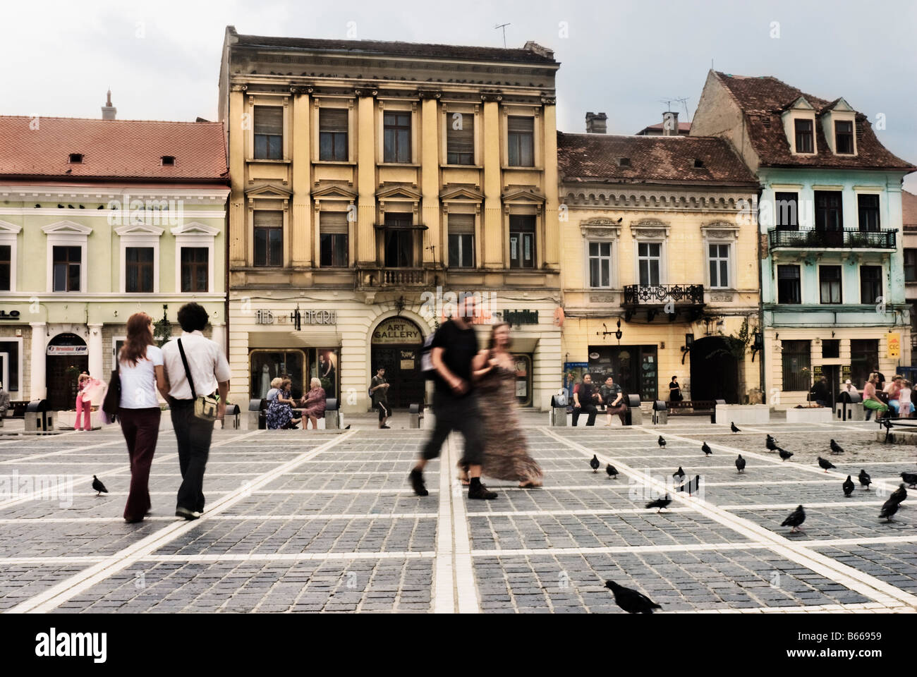 Tourists and locals relax in Pata stafalui main town square Brasov Romania Stock Photo