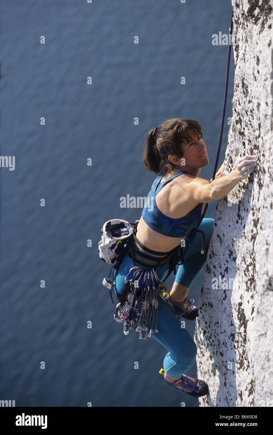 Woman rock climbing Stock Photo - Alamy