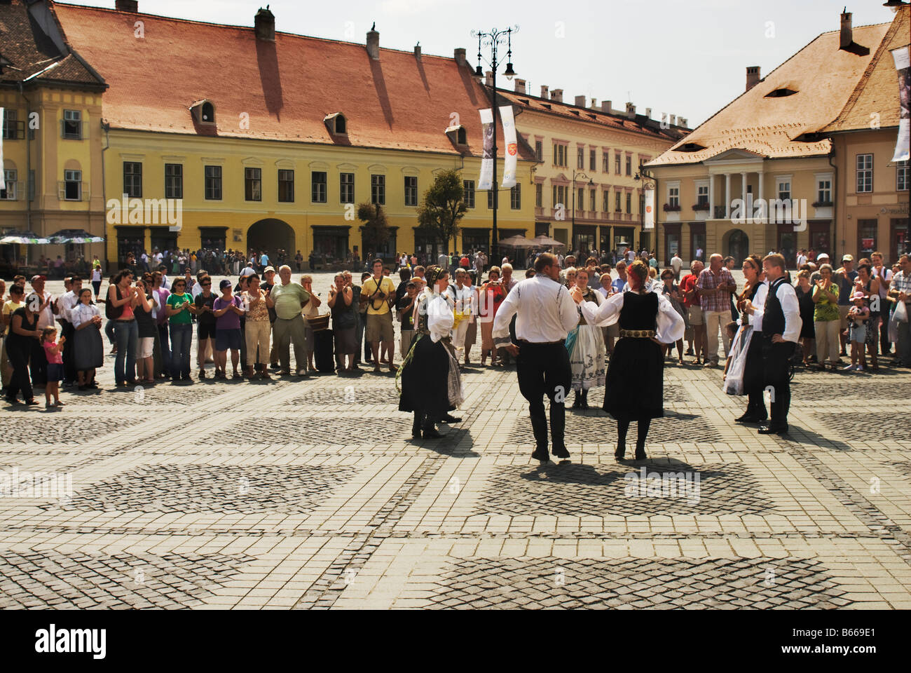 Traditional dancing in the main town square of Piata Mare in Sibiu Romania Stock Photo