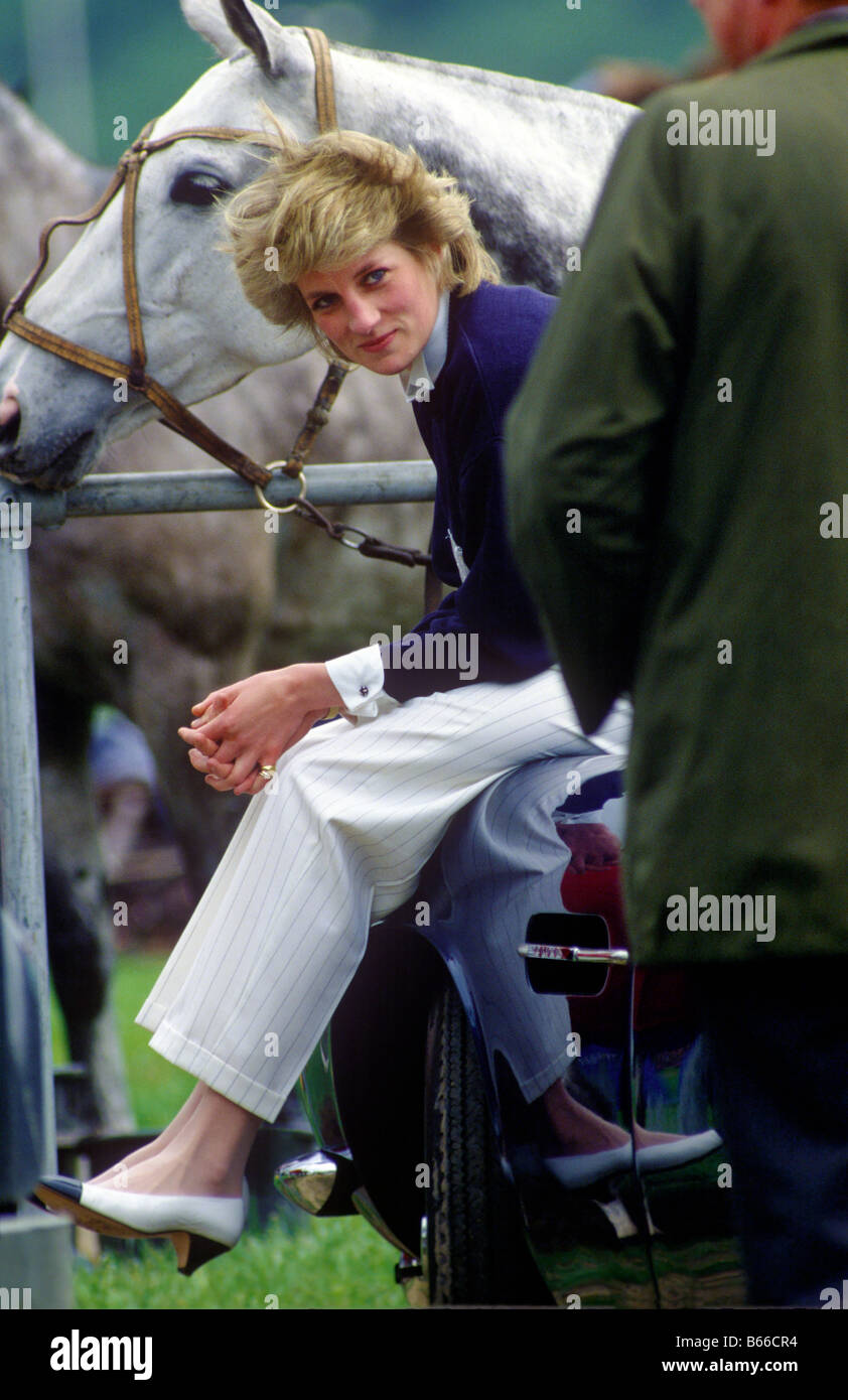 Princess Diana sitting on boot of Prince Charles Aston Martin at Guards Polo Club Windsor Stock Photo