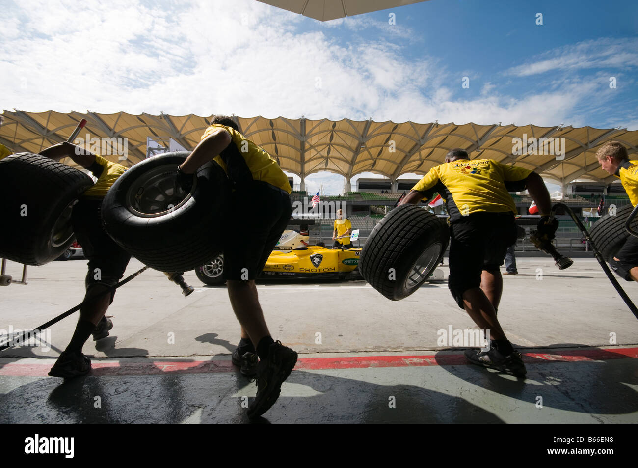 A1 Team Malaysia pit crews practice tyre change at A1GP World Cup of Motorsport in Sepang Malaysia November 22 2008 Stock Photo