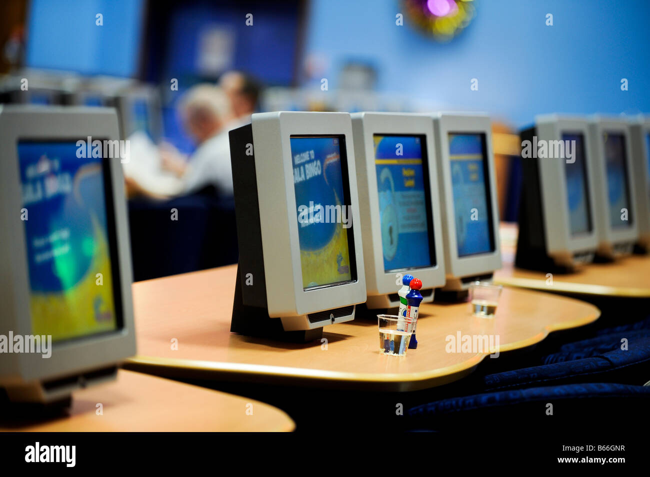 Gala Bingo hall with screens and daub pens ready for a game. Stock Photo