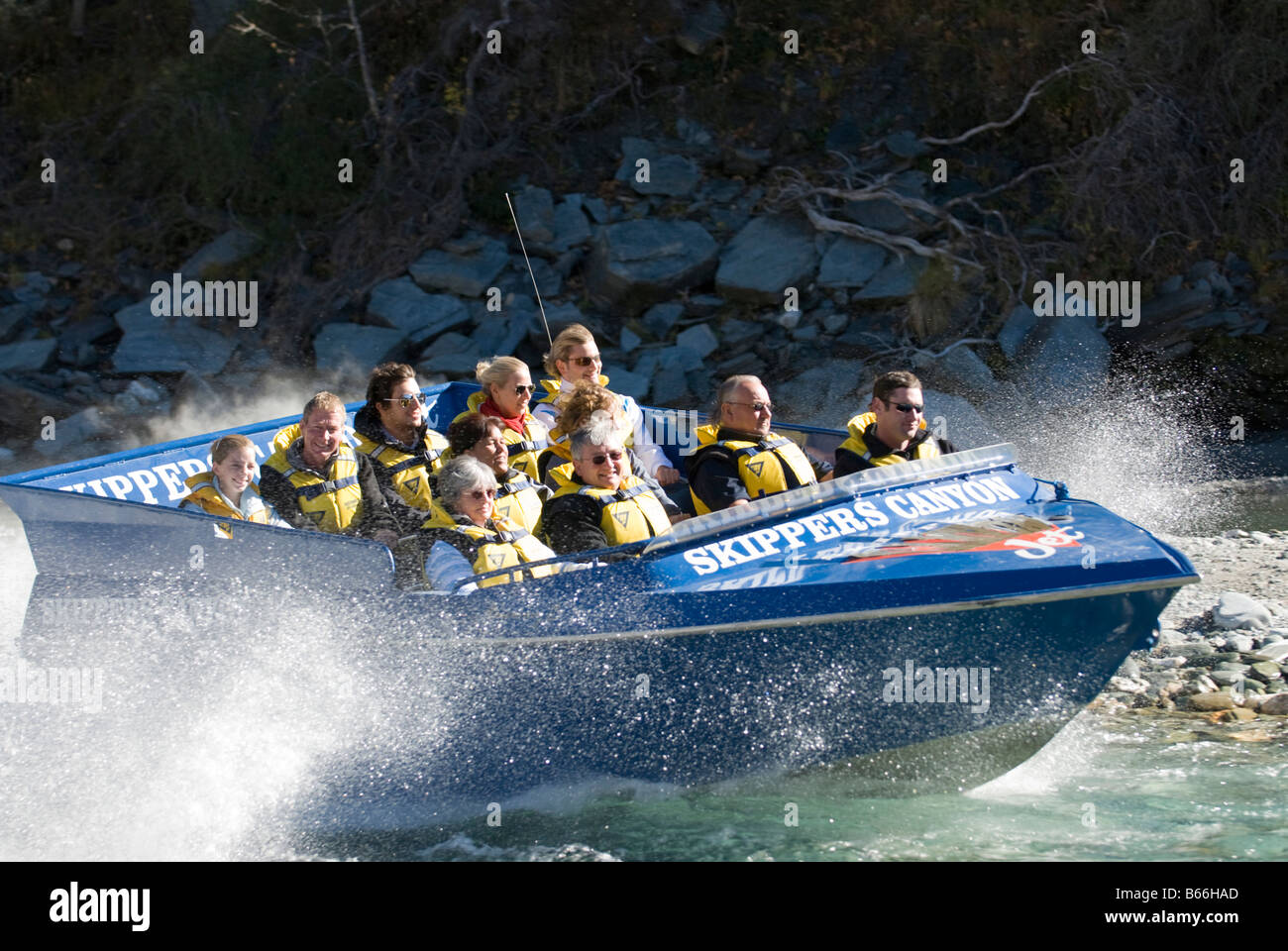 Tourists enjoying themselves in the Skippers Canyon jetboat on the Shotover River,  Central Otago Stock Photo