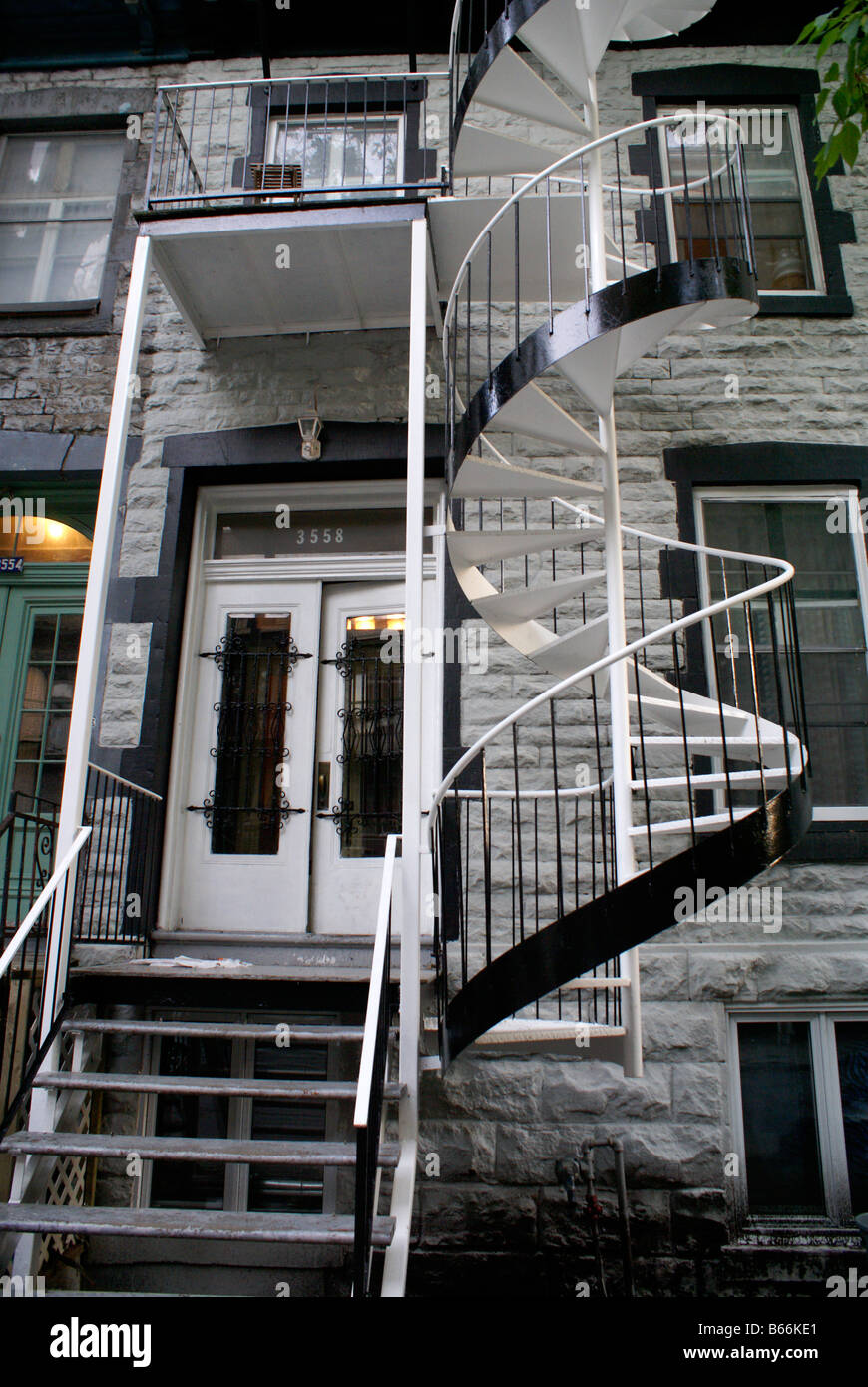 Black and white metal spiral staircase of an old house in Le Plateau Mont Royal, Montreal, Quebec, Canada Stock Photo