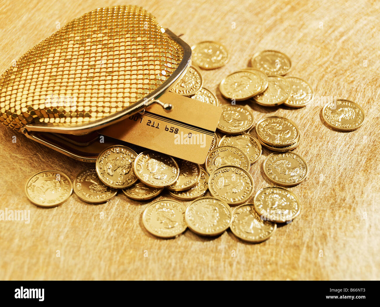 purse-overflowing-with-credit-card-and-coins-stock-photo-alamy