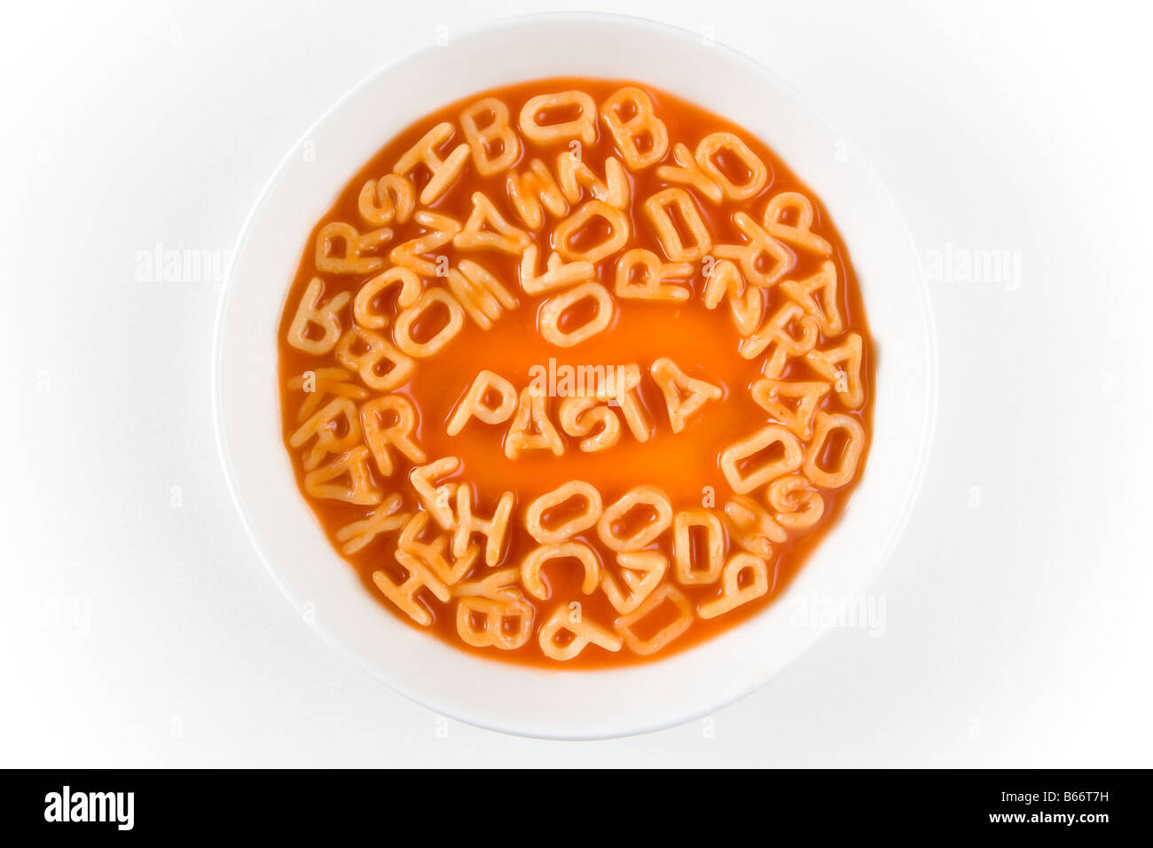Pasta spelling out words pasta in white bowl Stock Photo Alamy