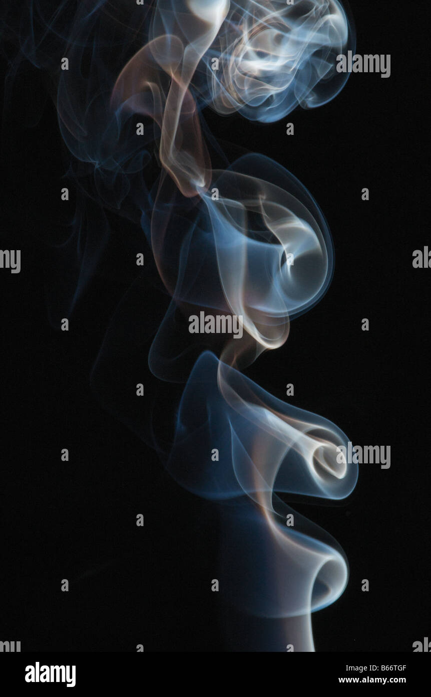 Blue smoke on black background Stock Photo - Alamy