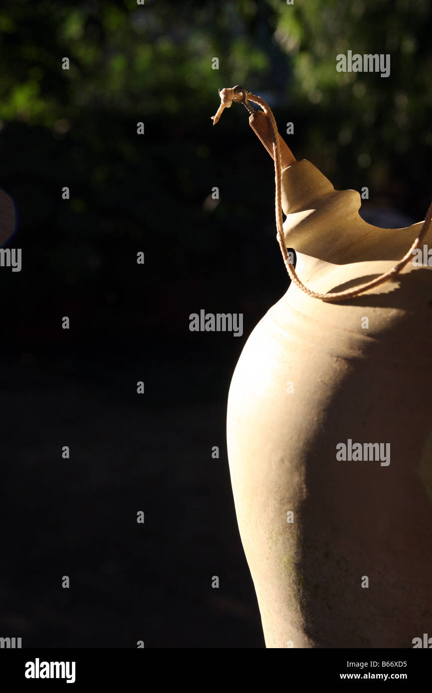 Close-up of a sunlit Spanish 'botijo' (earthenware drinking jug) Stock Photo