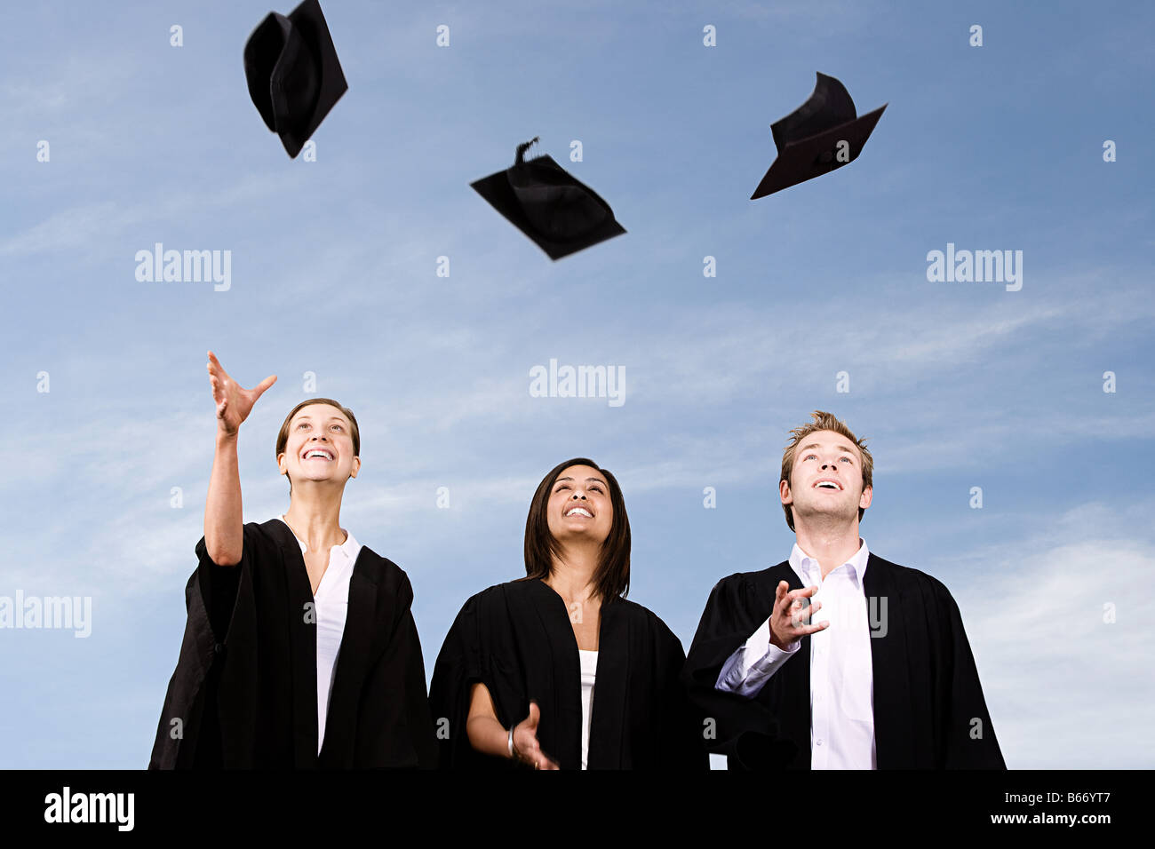 Portrait of young man in graduating cap and gown hi-res stock ...