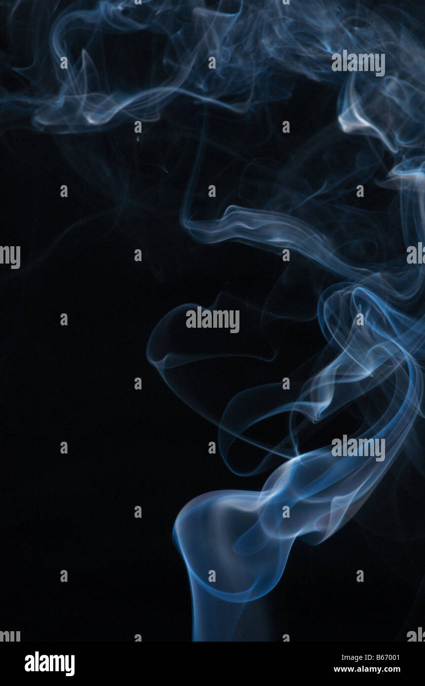 Blue smoke on black background Stock Photo - Alamy