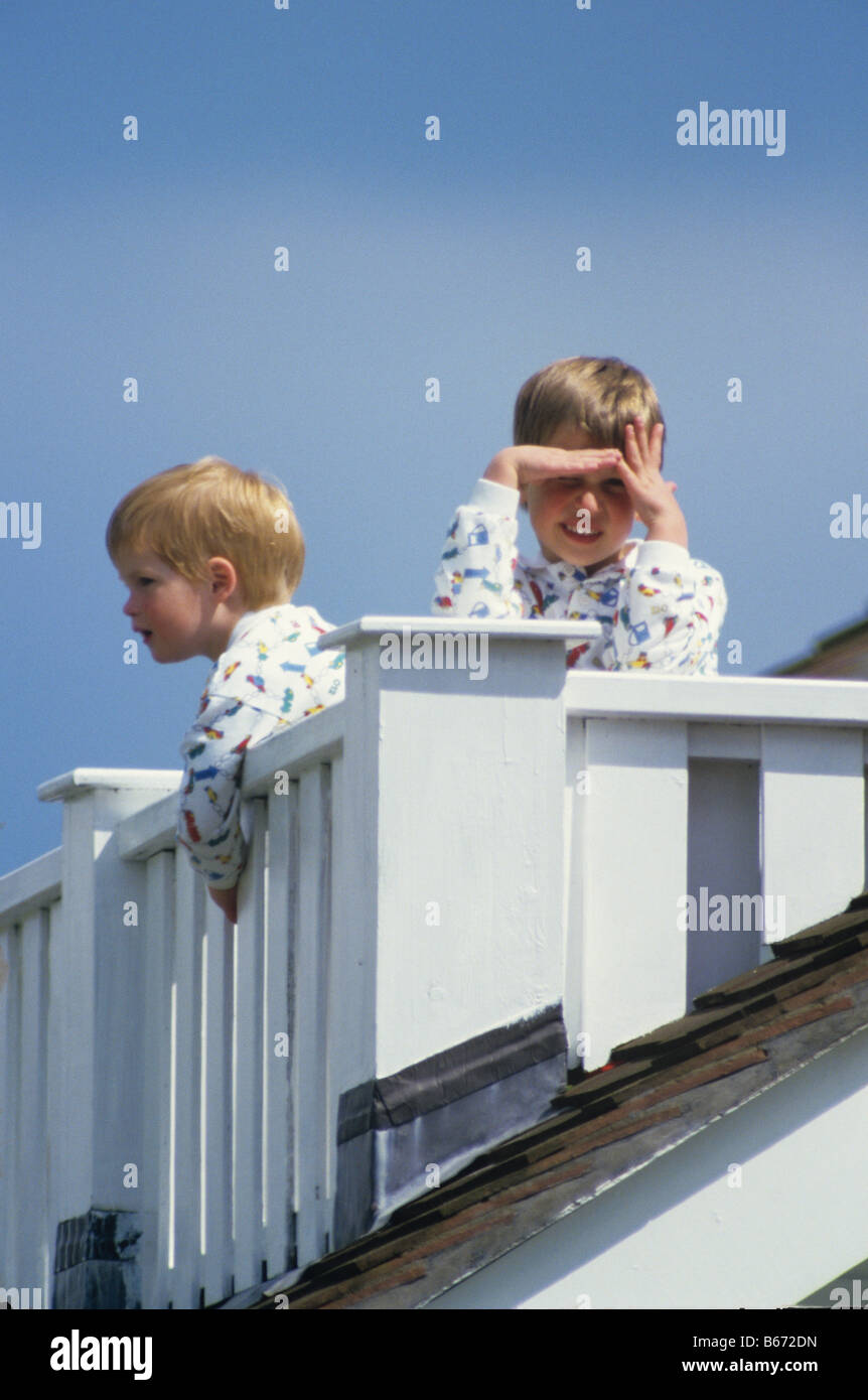 Young Prince Harry and Prince William at Guards Polo Club Windsor on the balcony of the Royal box Stock Photo