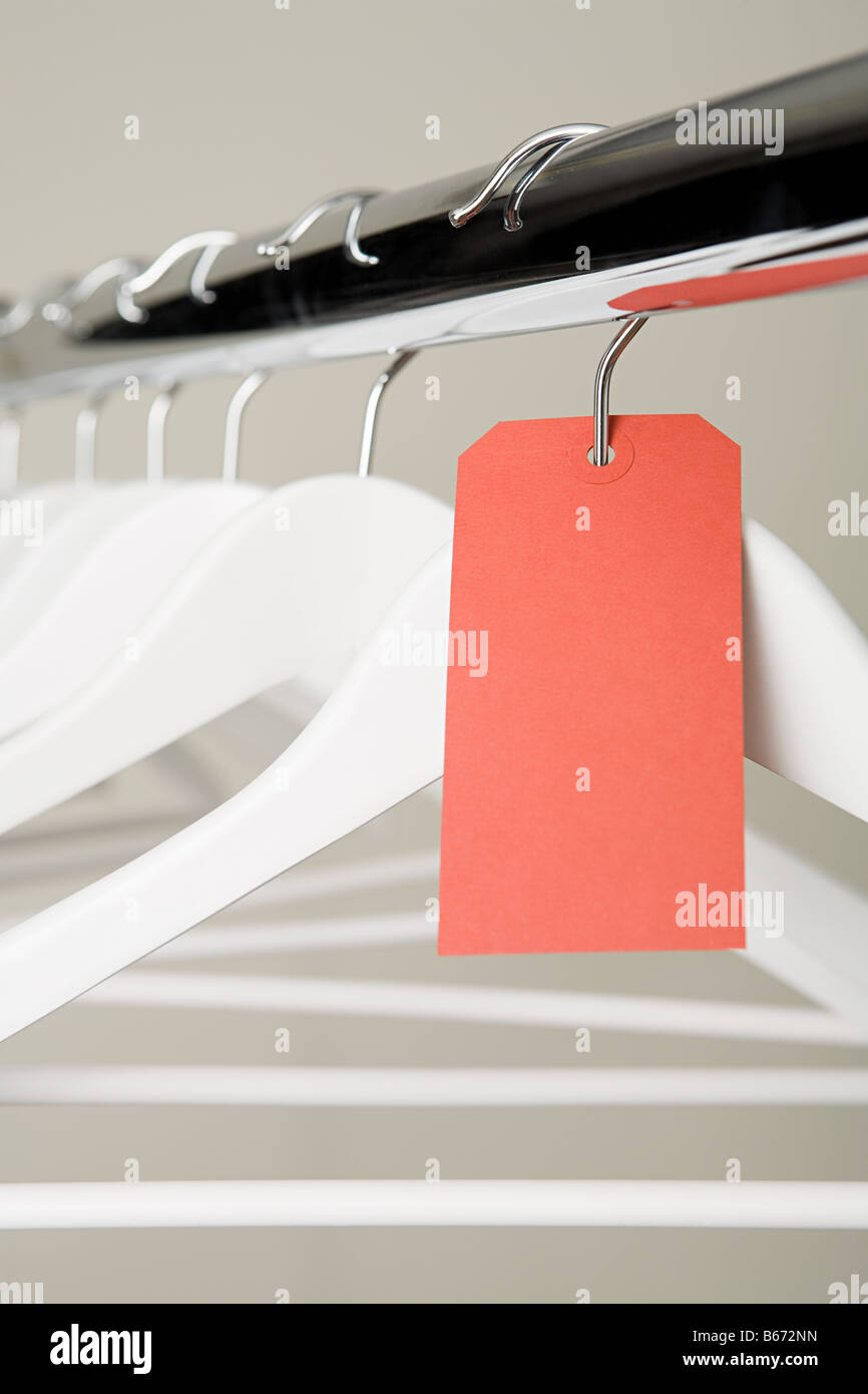 Red label on a clothes hanger Stock Photo Alamy