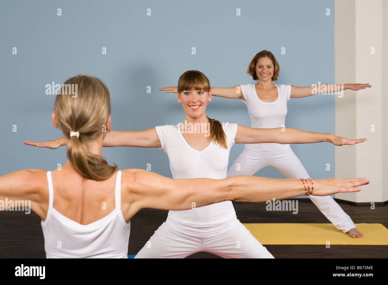 Three women practising yoga Stock Photo Alamy