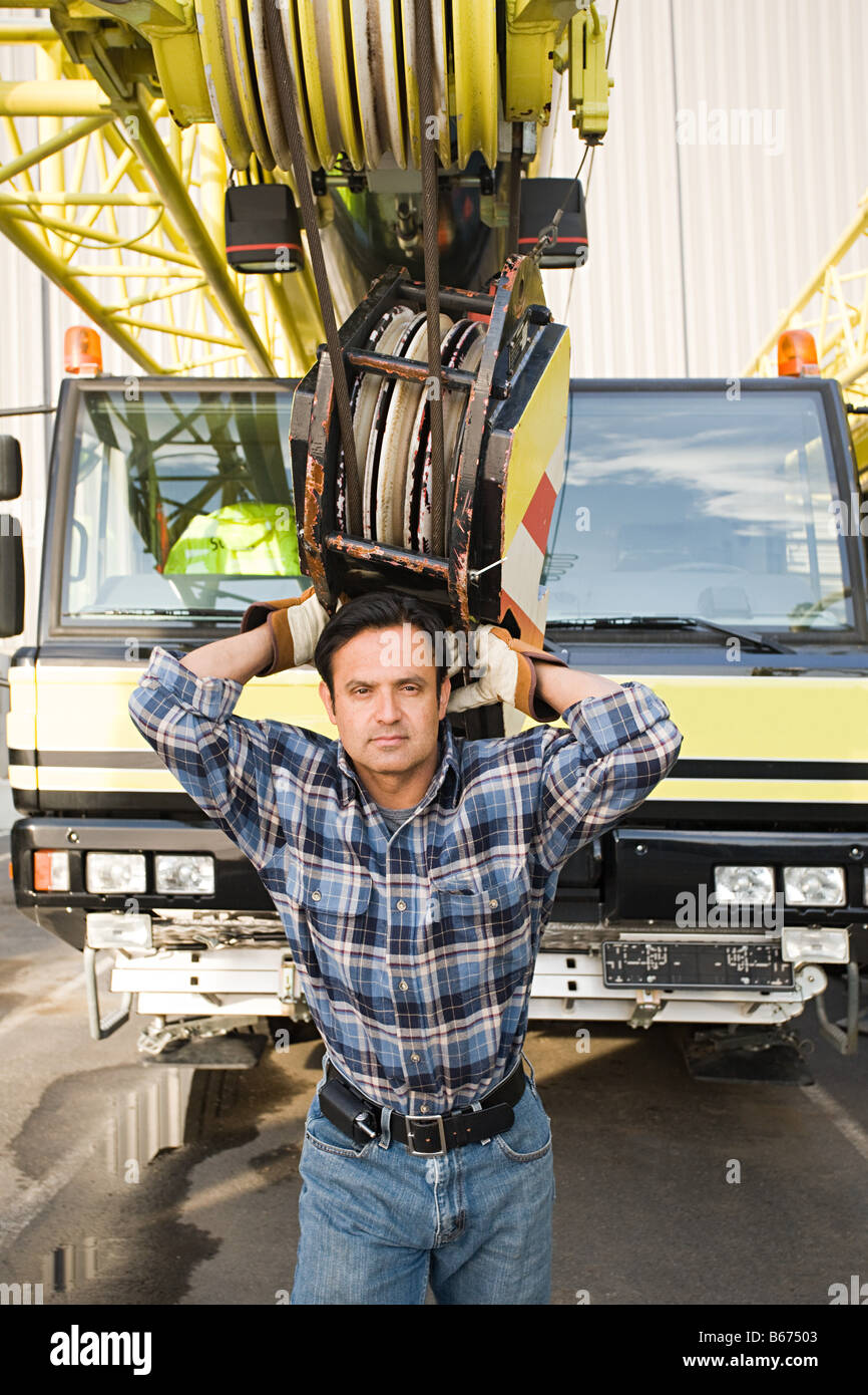 Man with crane truck Stock Photo - Alamy