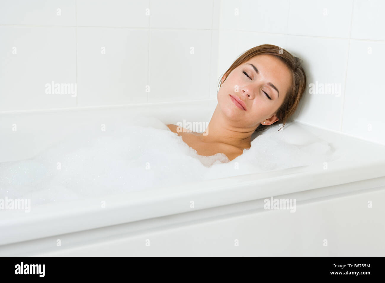 Woman sleeping in bath Stock Photo Alamy