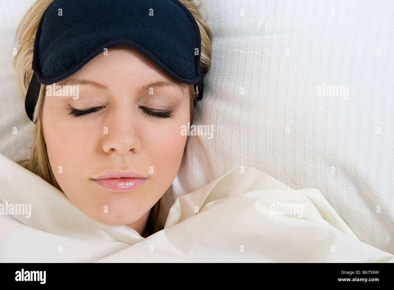 Sleeping woman wearing eye mask Stock Photo Alamy