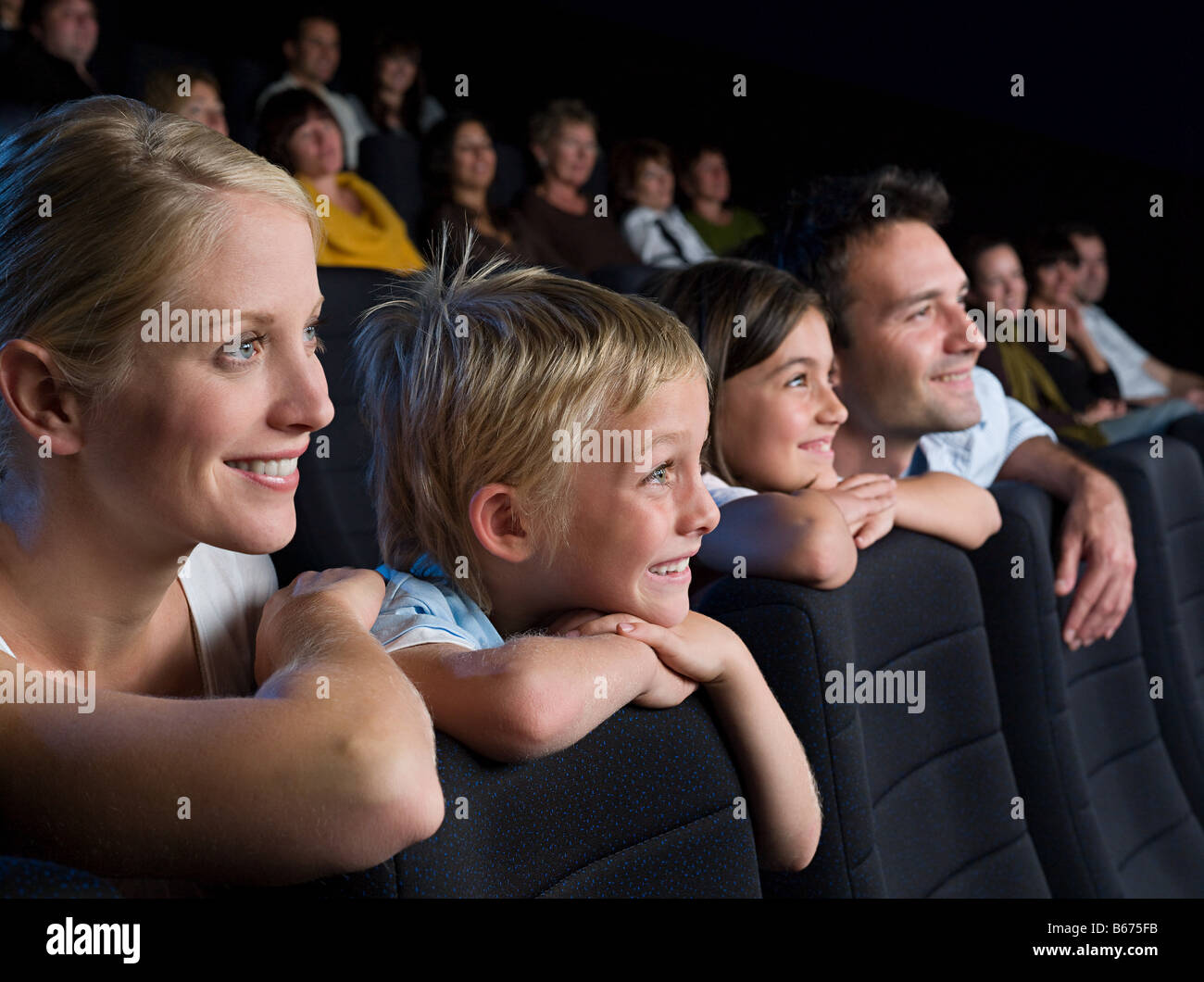 A family watching a movie Stock Photo