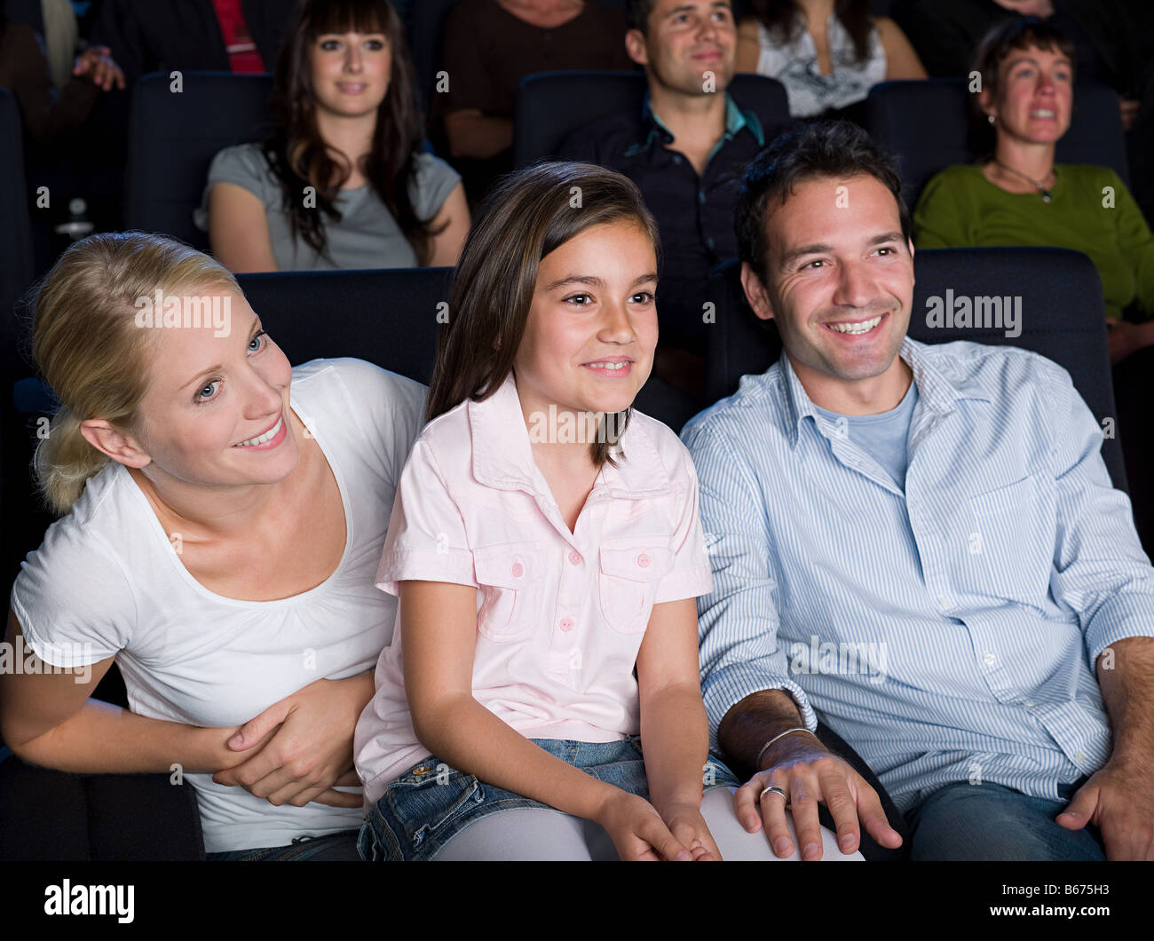 A family watching a movie Stock Photo