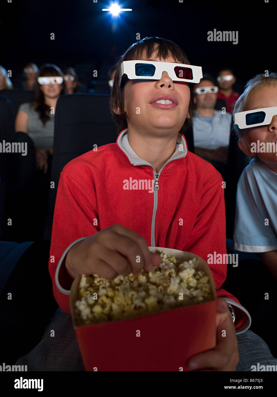 A boy watching a 3d movie Stock Photo