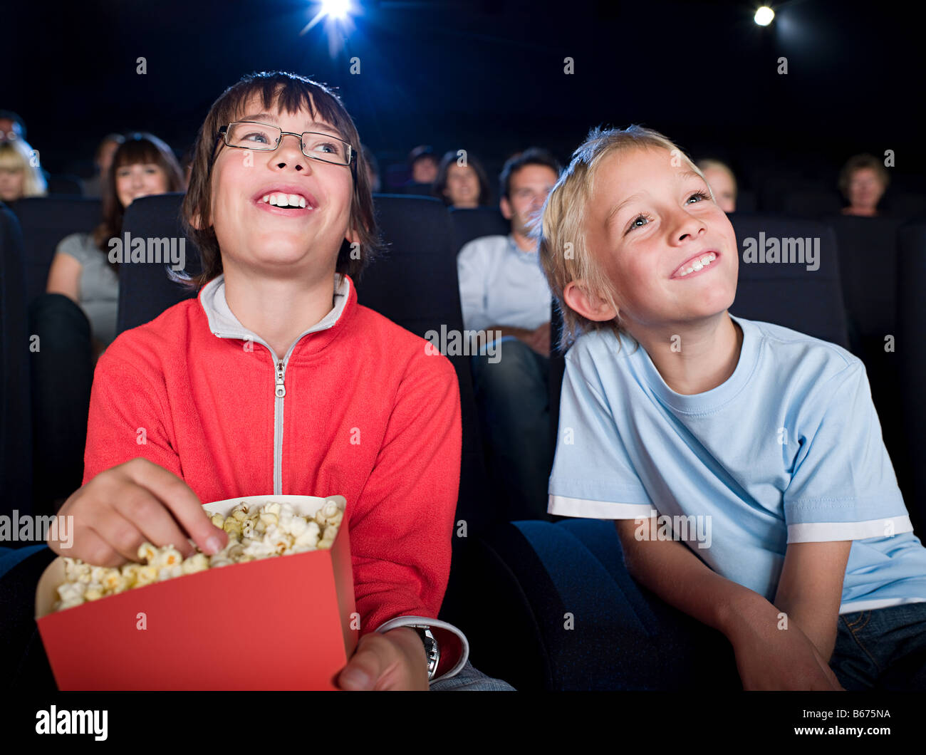 Two boys watching a movie Stock Photo