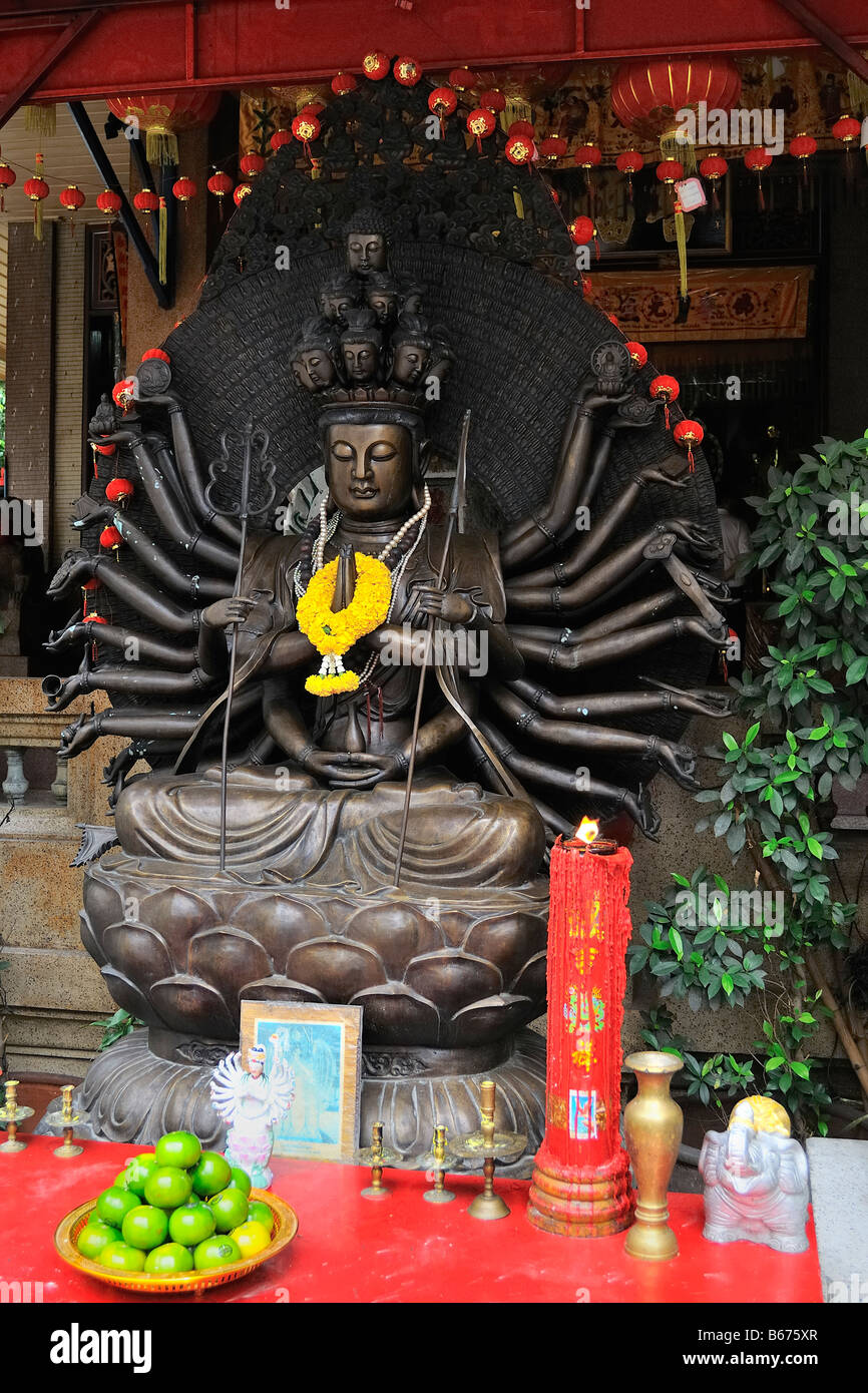 Guan Yin and the Thousand Arms statue in buddhist temple in Bangkoks chinatown, Thailand. Stock Photo