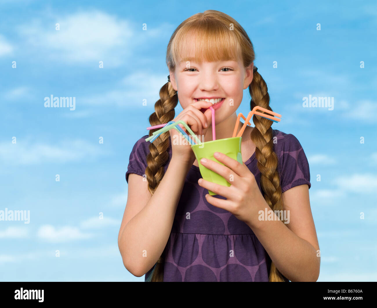 Child Drinking Through Straw Stock Photos & Child Drinking Through