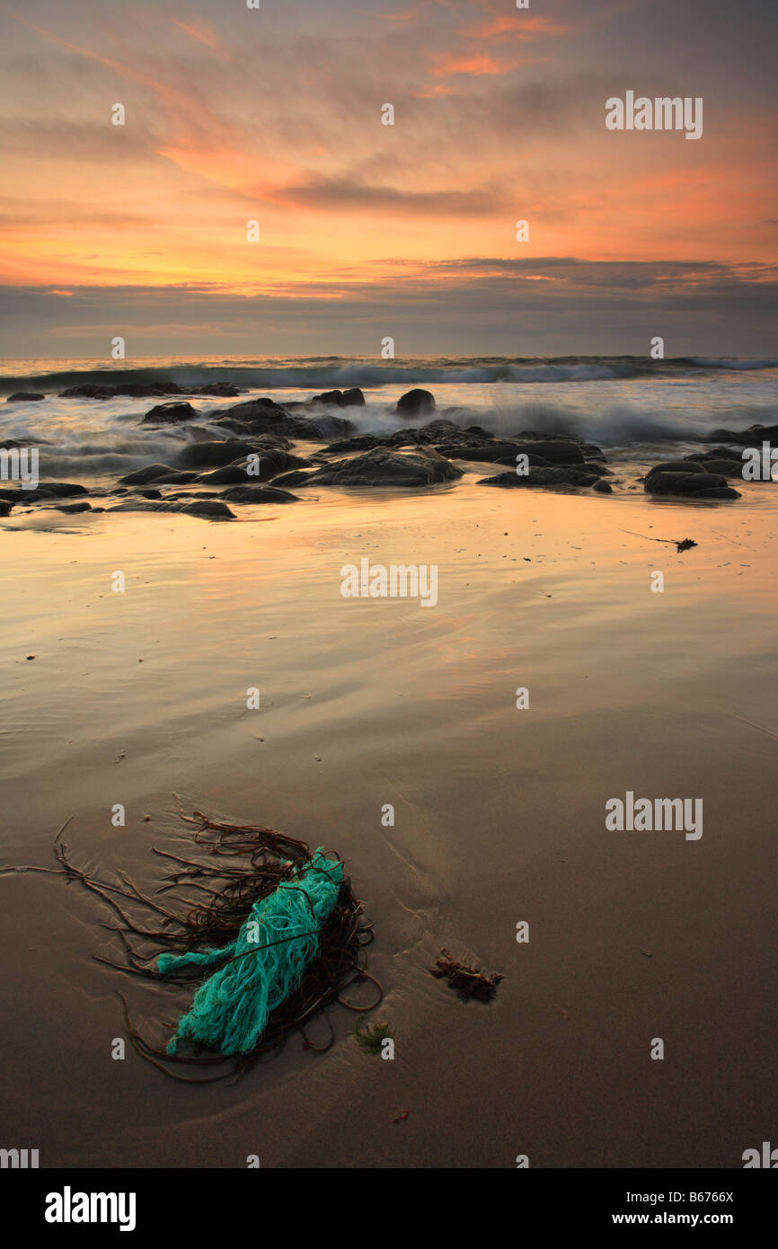 Flotsam 'Saligo Bay' Old blue rope washed up on the beach, Islay, Scotland. Stock Photo