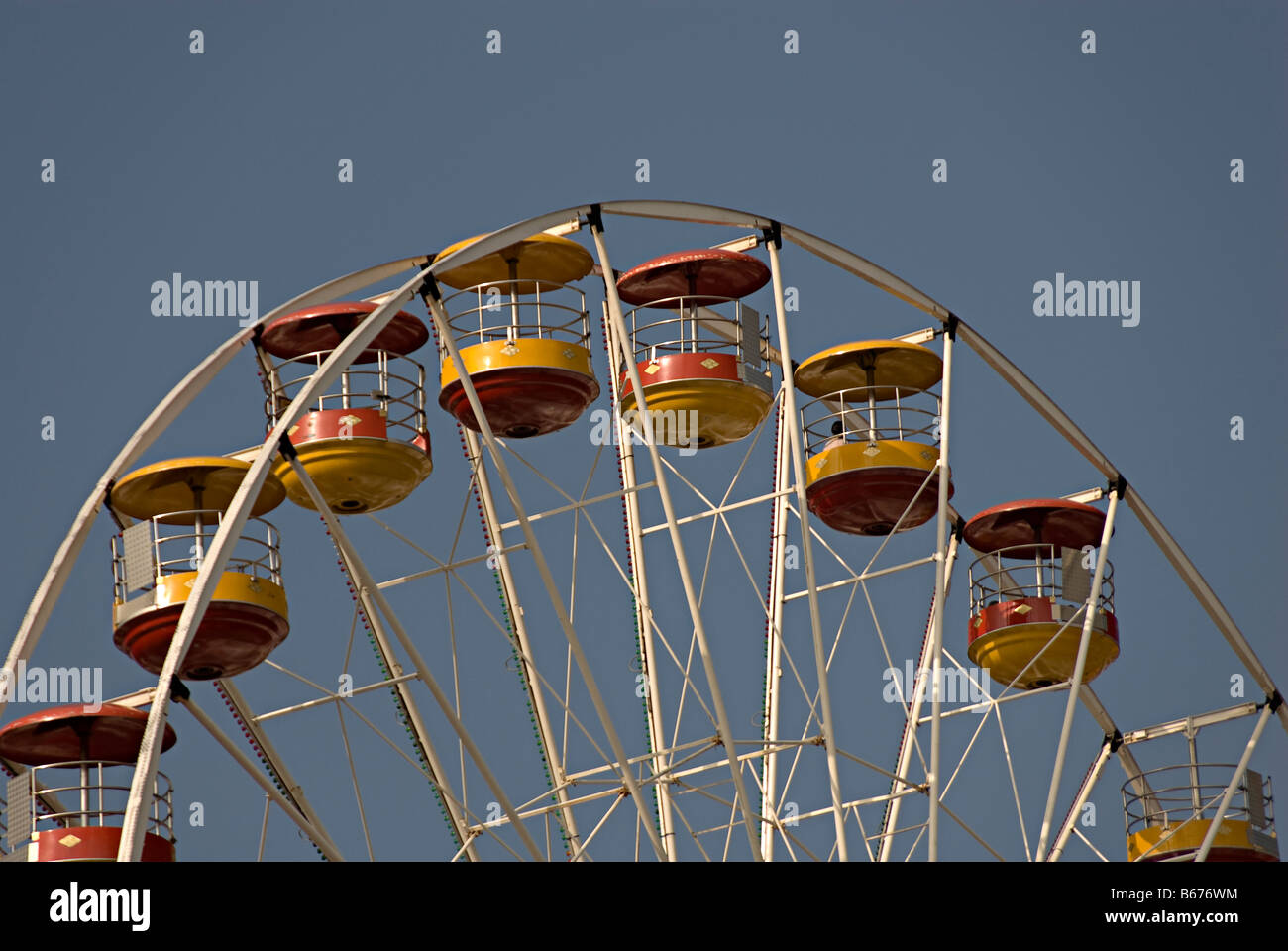 Ferris wheel in caernarfon north wales part of a travelling fair in the central square Stock Photo