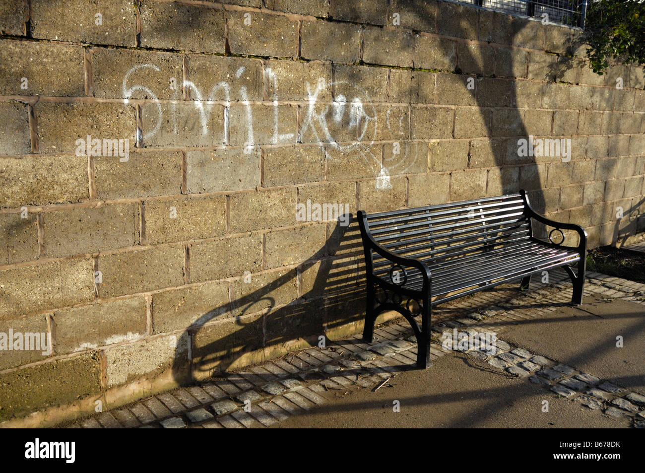 View of iron bench in morning sunshine Stock Photo
