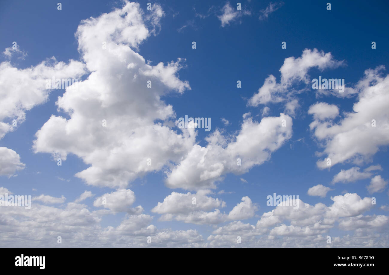 Blue sky and fluffy white clouds great as a background Stock Photo - Alamy