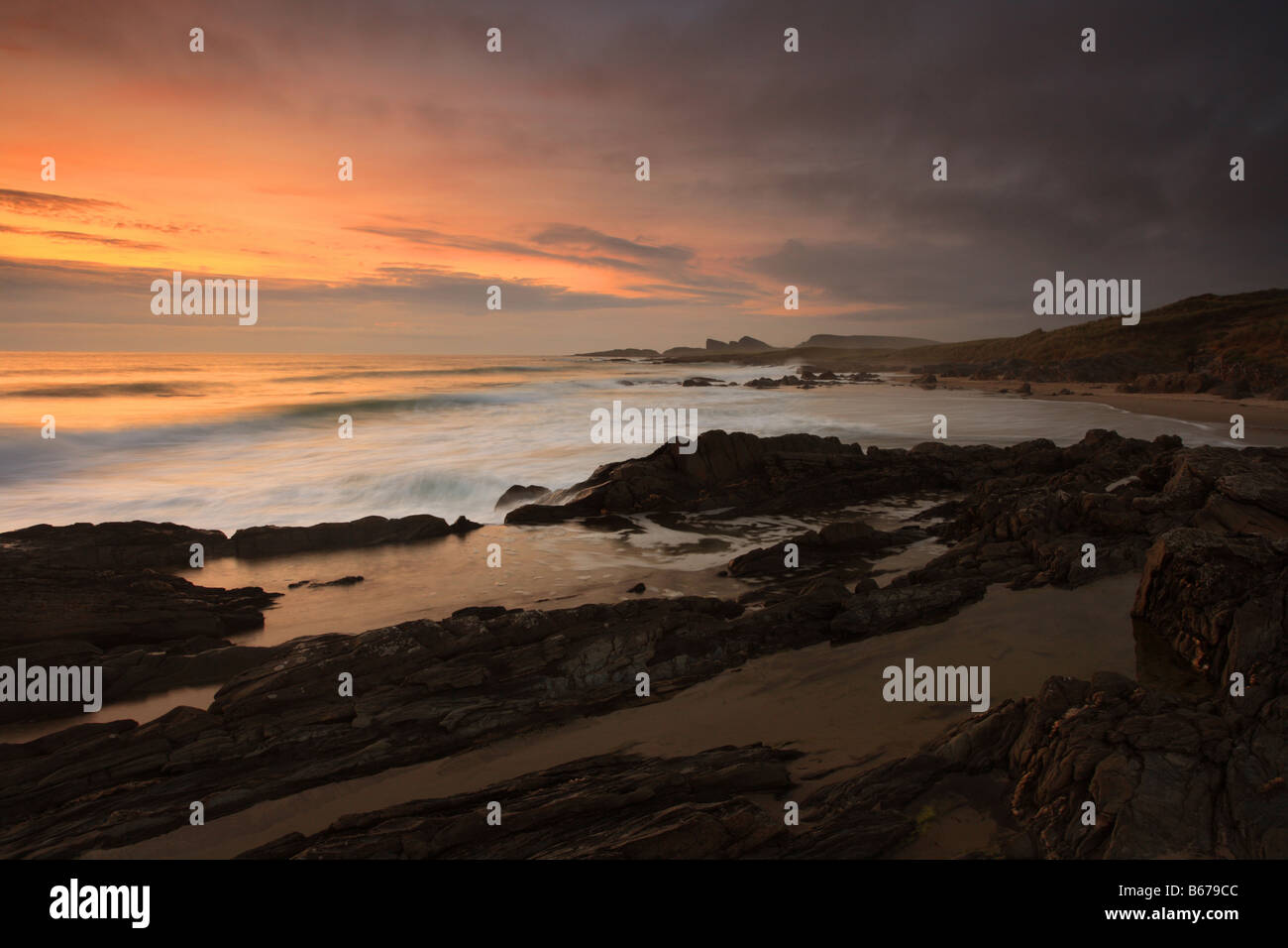 Scotland beach, 'Saligo Bay' sunset, waves rocks and sand. Stock Photo