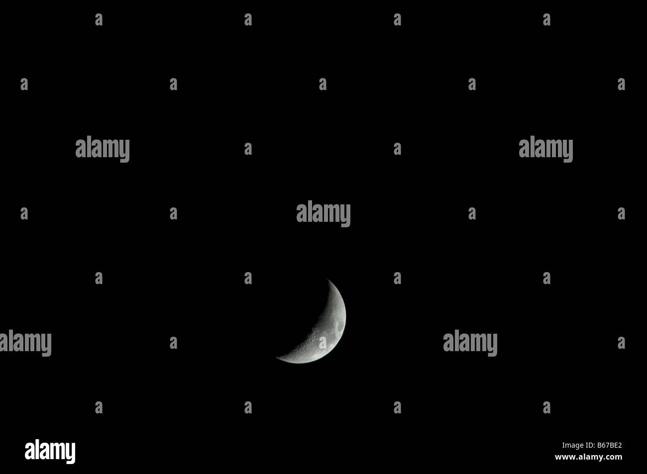 Crescent of a new moon at night Stock Photo Alamy