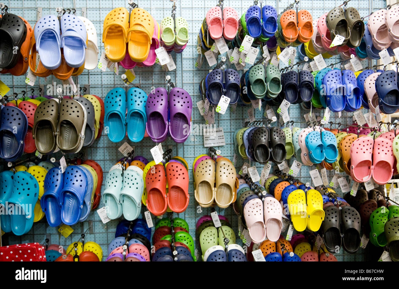 Colourful Crocs shoes for sale, Aldeburgh, Suffolk, England Stock Photo