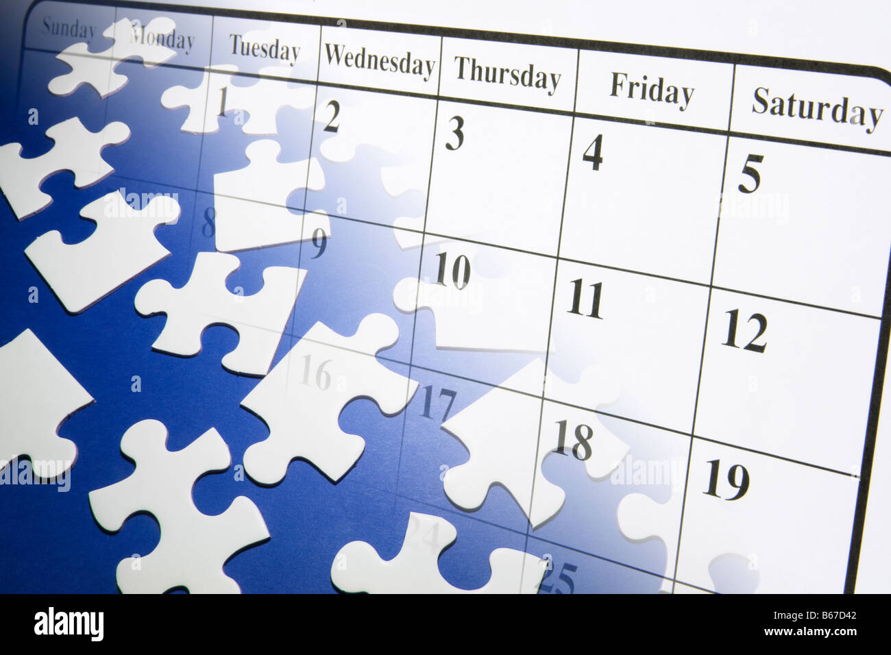 Jigsaw Puzzle Pieces and Calendar Stock Photo - Alamy