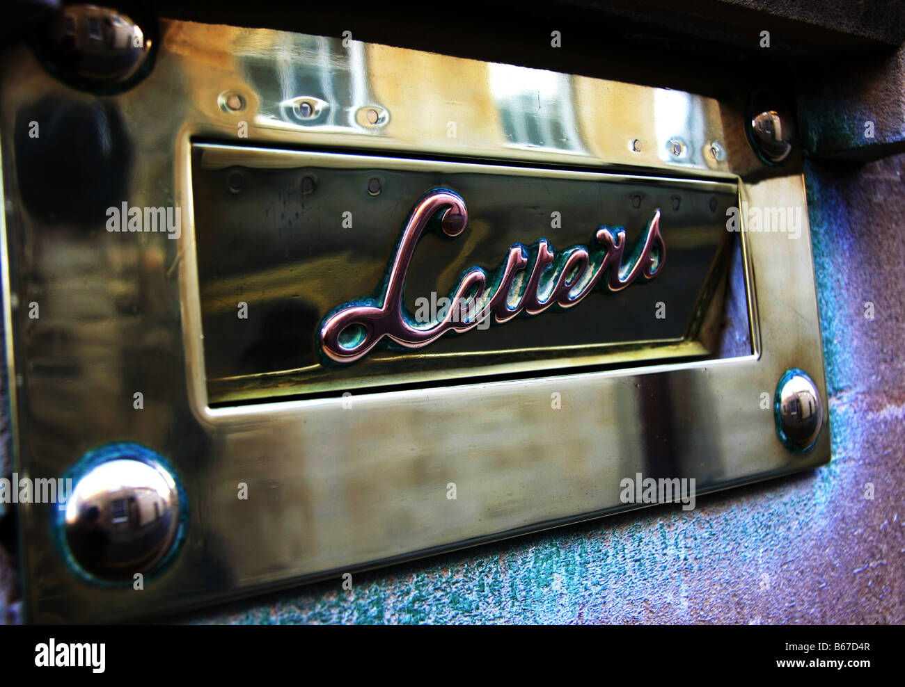 A highly polished brass letterbox Stock Photo Alamy
