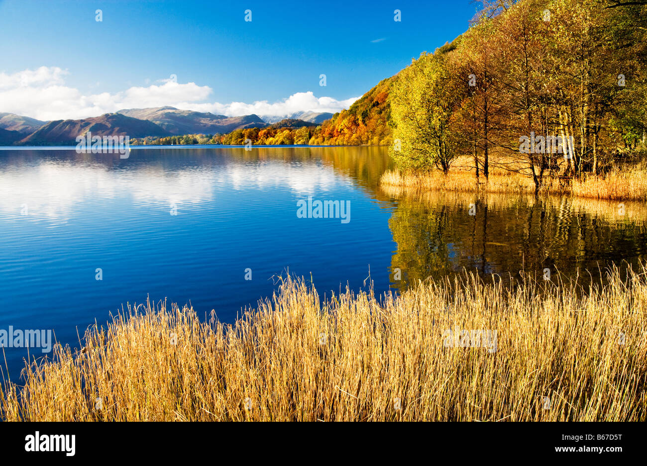 A sunny autumn day on the shores of Ullswater in the Lake District National Park Cumbria England UK Stock Photo