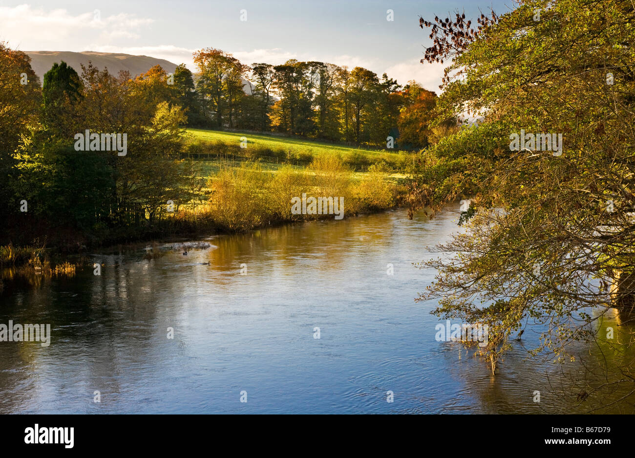 The view from Pooley Bridge onto the River Eamont as it flows into Ullswater in the Lake District Cumbria England UK Stock Photo