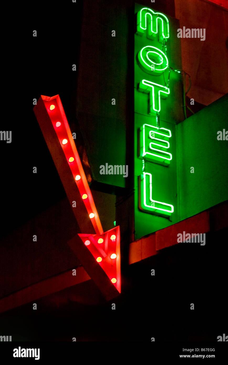 Neon motel sign with arrow at night in California, USA Stock Photo