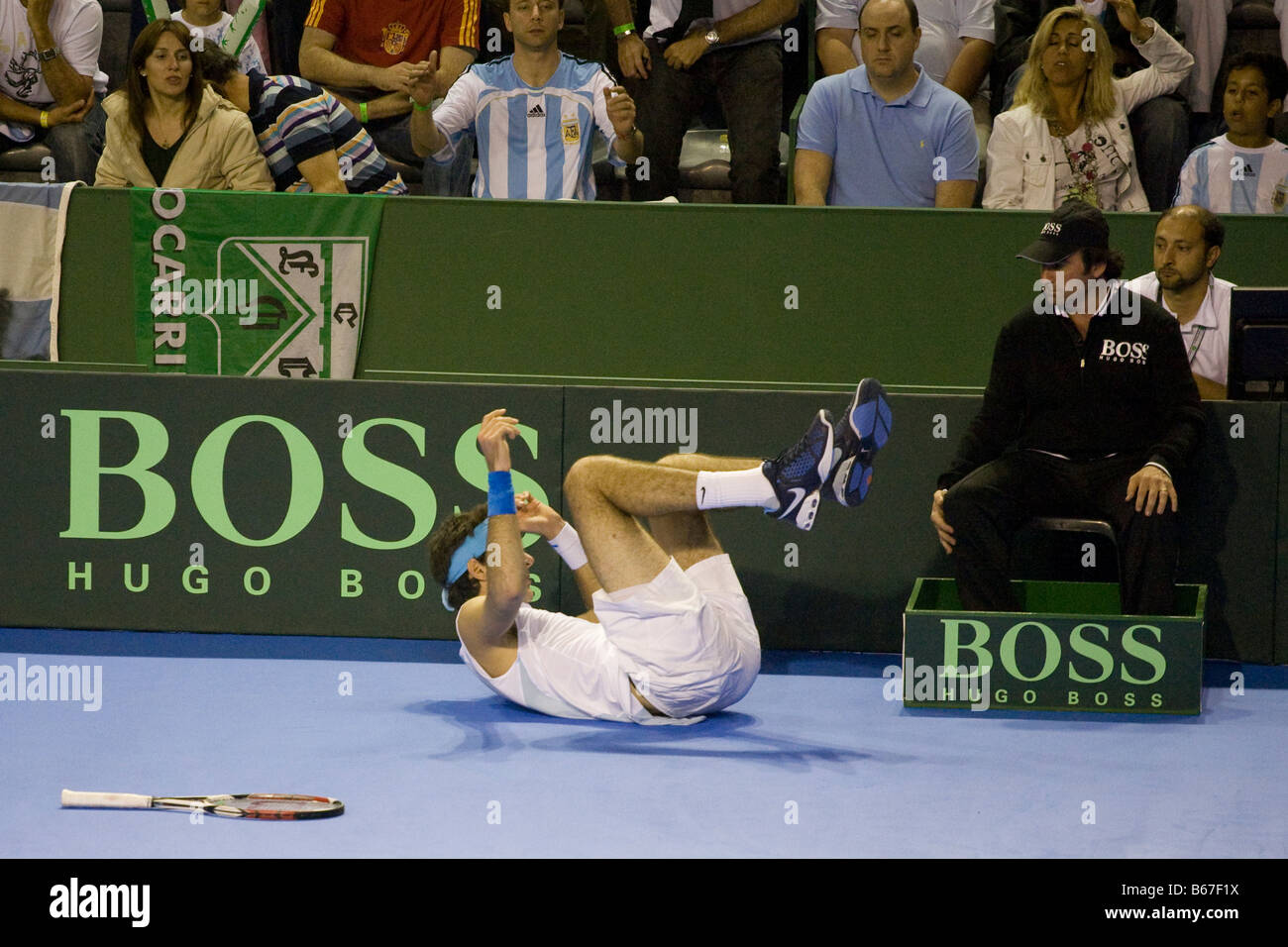 Argentinian tennis player Juan Martin Del Potro falls to the floor trying to hit a wide ball during the 2008 Davis Cup final Stock Photo