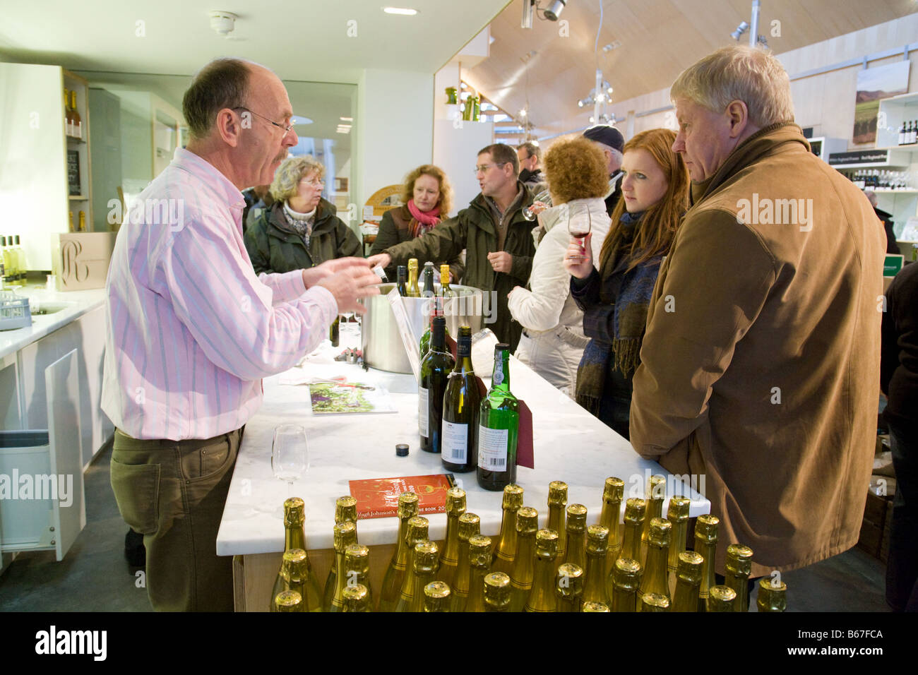 People wine tasting; Adnams store, Southwold, Suffolk, England Stock