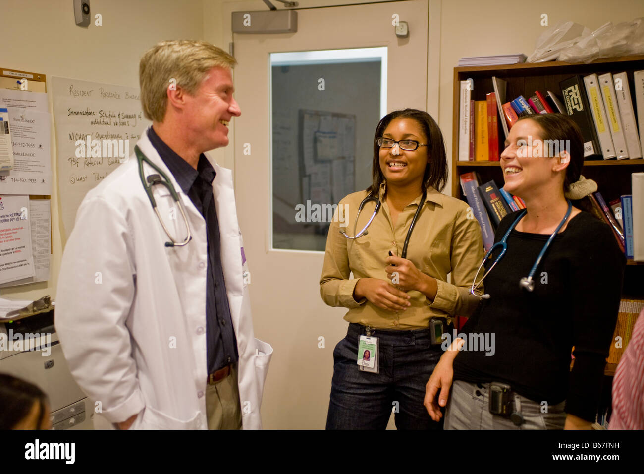 Group of multiracial doctors talking at Childrens Hospital of Orange County in Orange, California, USA Stock Photo
