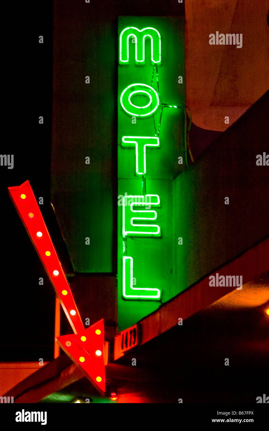 Neon motel sign with arrow at night in California, USA Stock Photo
